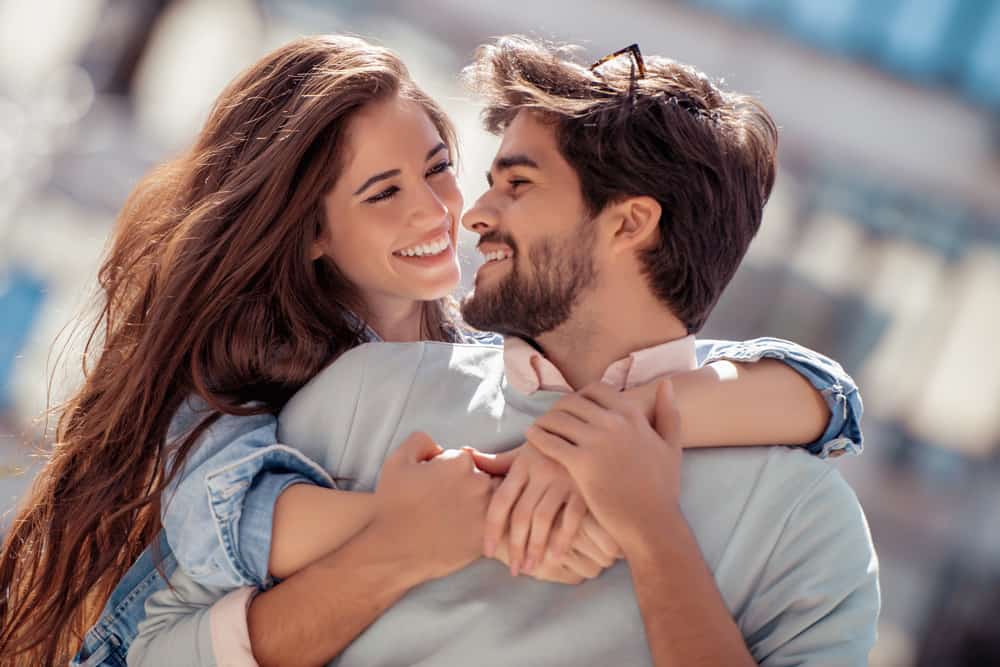 Happy Couple Smiling At Each Other